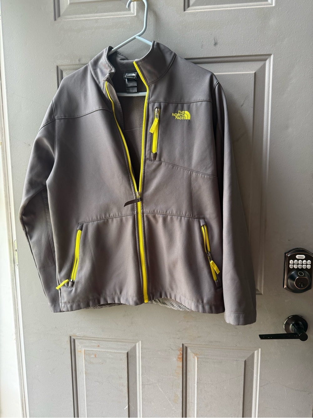 The North Face Gray Softshell Jacket with Yellow Zippers